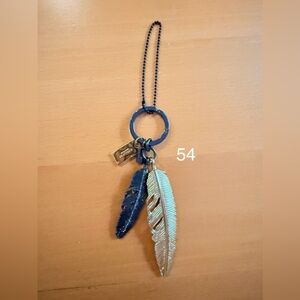 Coach Metal Gold and Black Feather Hangtag with Keychain. (54)
